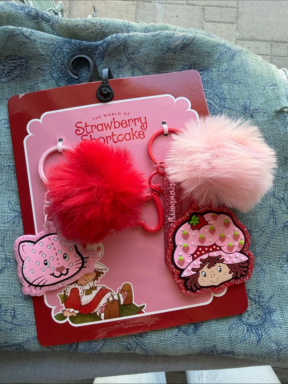 The World of Strawberry Shortcake Pink & Red Pom Keychain Duo